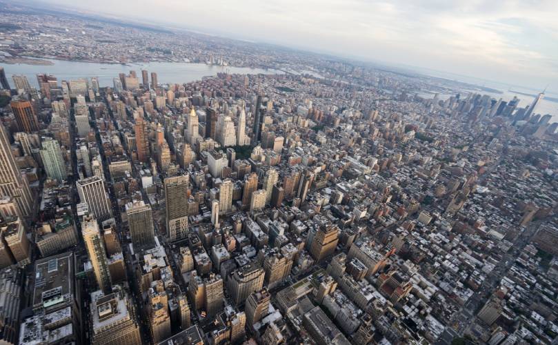 Overhead view of a huge city on a cloudy day