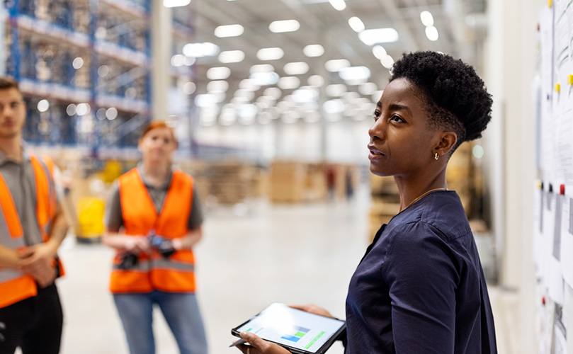 Factory supervisor monitoring product levels on interactive display