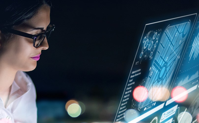 A woman looking to a Computer screen