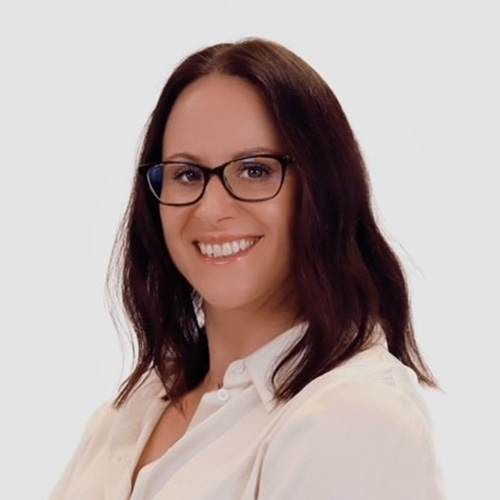 Headshot of Hannah Mitchison, wearing glasses with brunette hair.