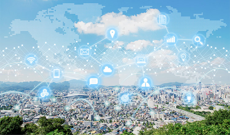 Aerial view of a city with an overlay of a world map and interconnected digital icons representing technology and global connectivity.