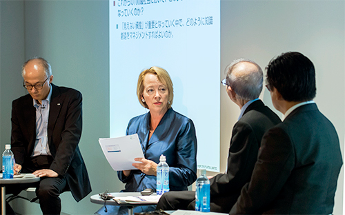 Panel discussion with four speakers on stage