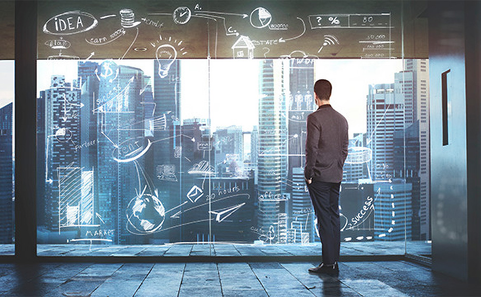 Businessman overlooking city with strategy sketches.