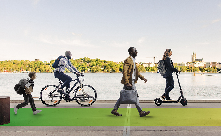 Four people moving in sustainable ways along a waterfront road ・A young person running carrying a rucksack and a book  ・A person on a bicycle with a backpack  ・A person walking with a bag   ・A person on an E-scooter