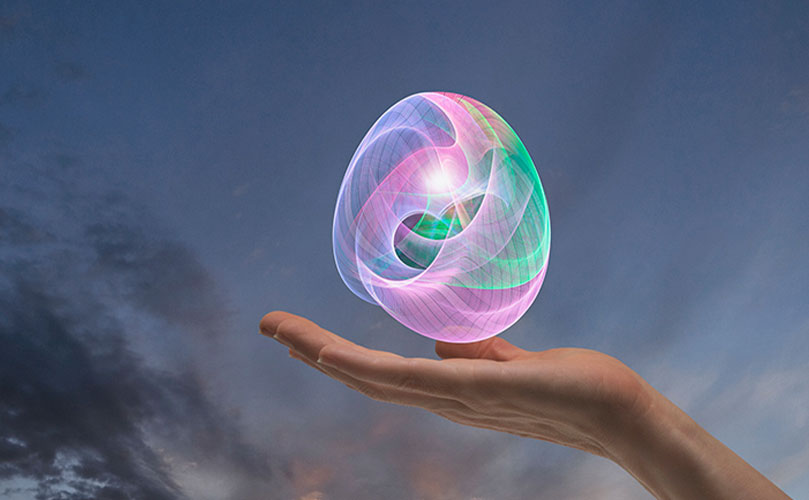 Una mano sosteniendo una esfera colorida