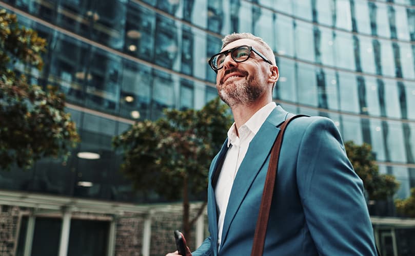 man looking to a building