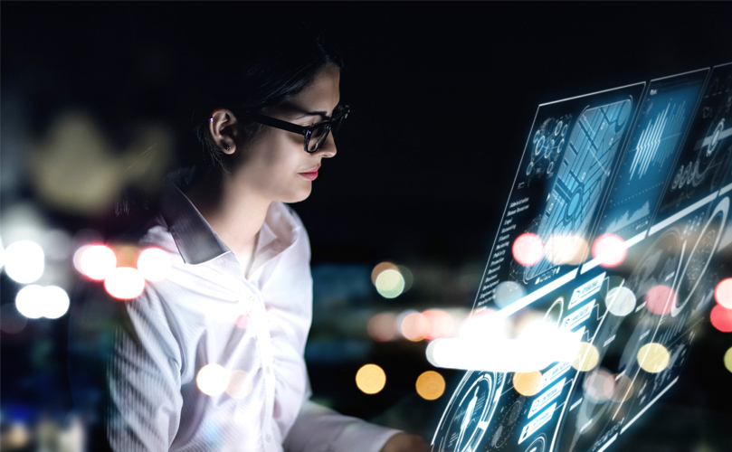 A woman looking at a screen