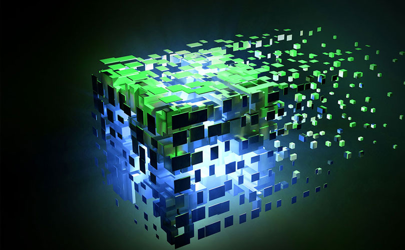 A 3D digital illustration of a cube composed of smaller, glowing green and blue cubes that appear to be disassembling or floating away from the main structure.