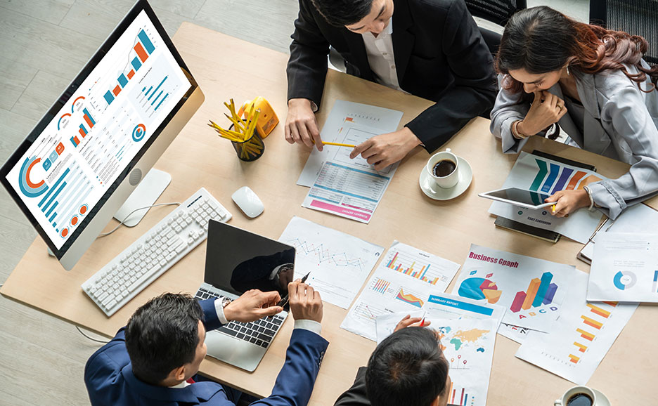 Project team brainstorming session from an elevated perspective.