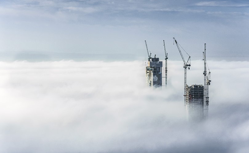 Two buildings above the clouds