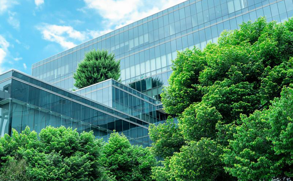Modern business building with abundant greenery.