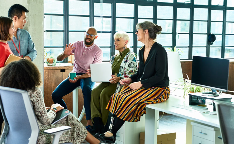 Six project members conversing