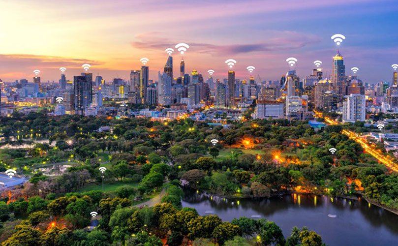 A smart city with a sunset backdrop, showcasing a wifi network and seamless internet connection