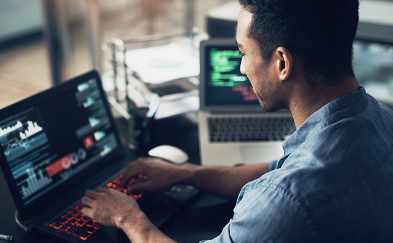 Man working on his laptop depicting technical security's deployments and professional services