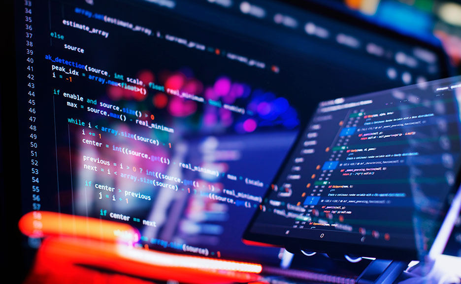 プログラミングコードが書かれたパソコンの画面を映した写真。