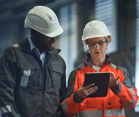 Colleagues using digital tablet during their work.