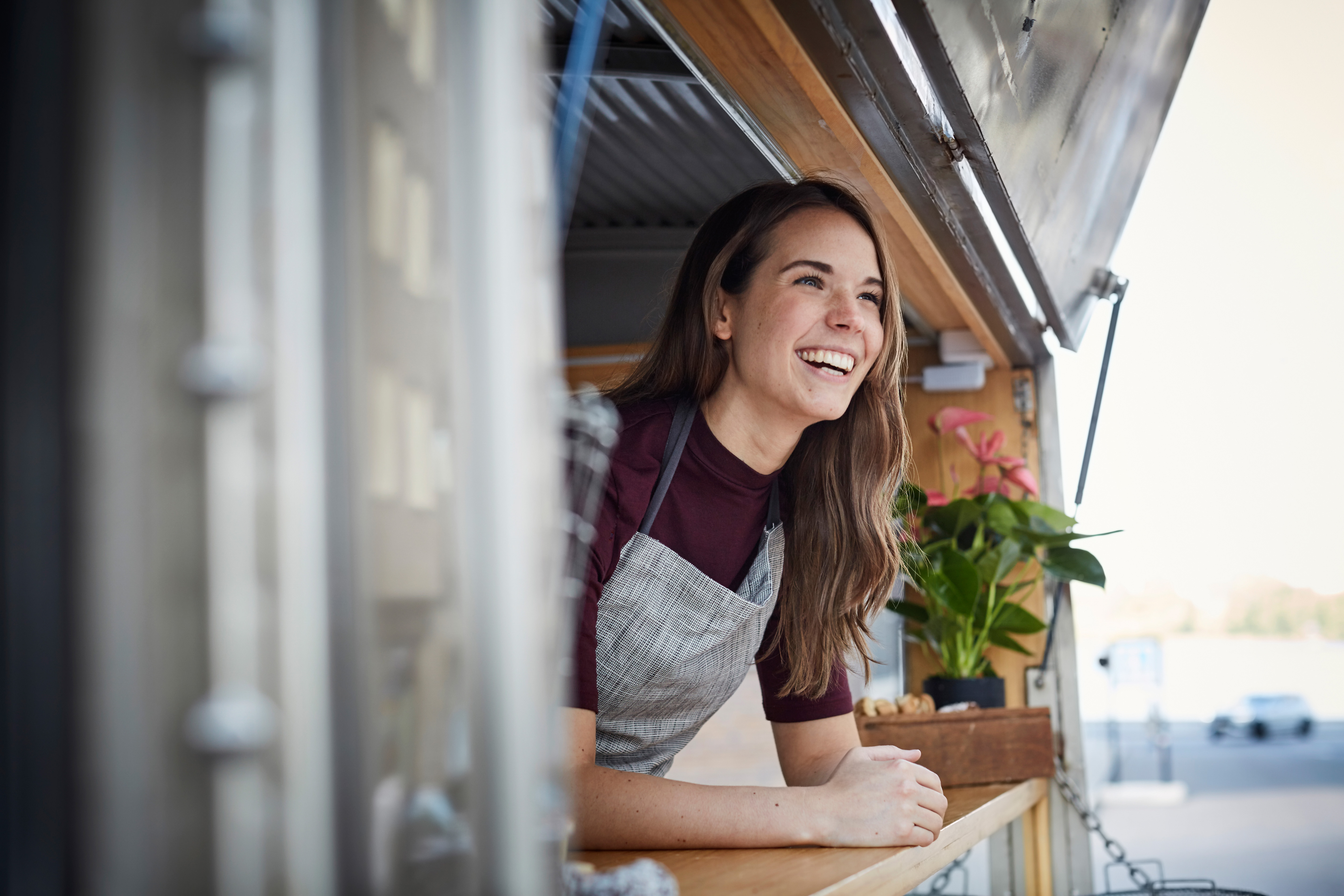Woman looking out the shopfront depicting evolution of enterprise data management