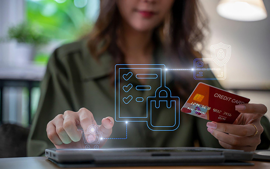 A woman using her credit card online depicting governance, risk and compliance