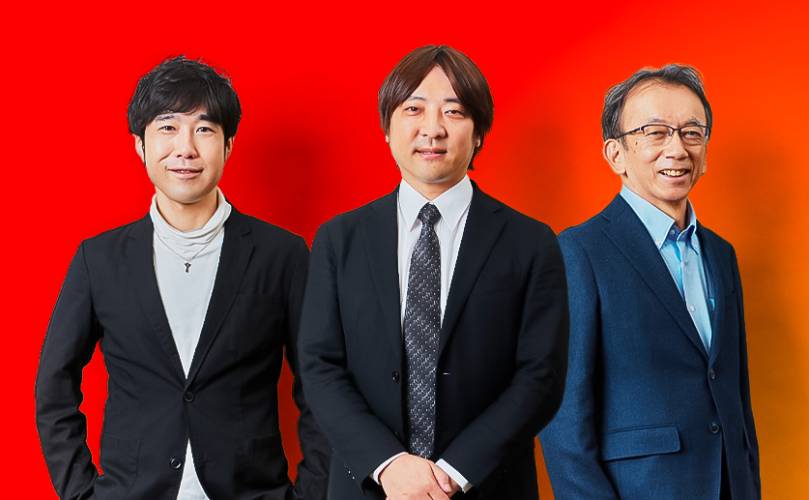 Three men smiling looking at the camera in a red background