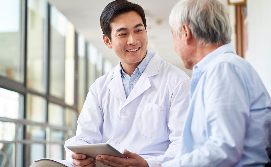 Doctor and patient smiling and talking