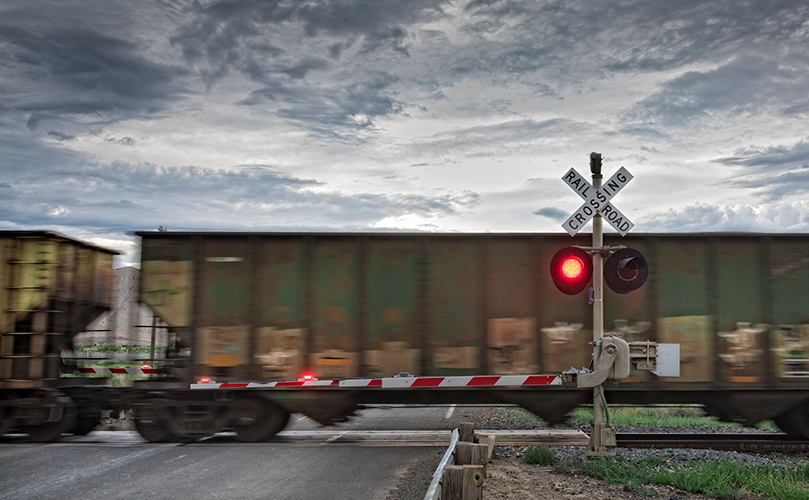 Image of train passing a level crossing depicting getting on track with Enterprise Integration Platform