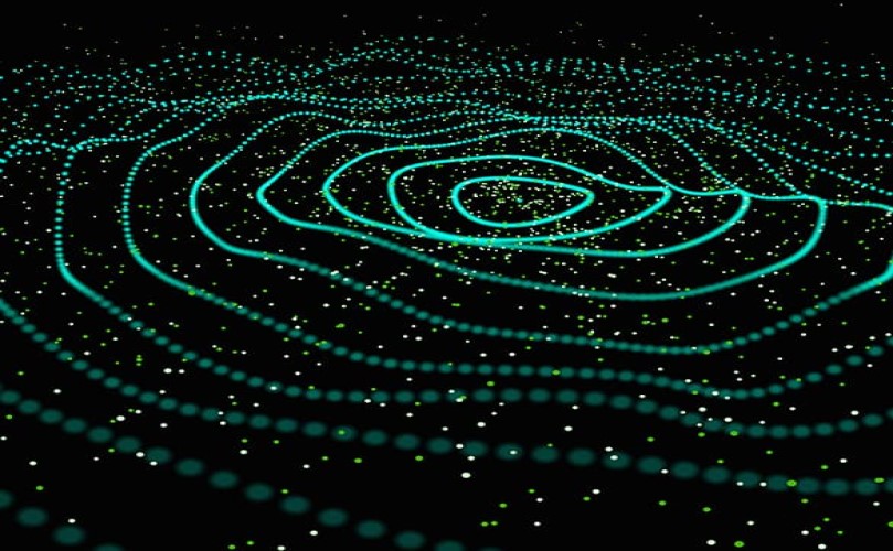 Green dots organized in circles in a black background
