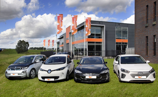 Four LeasePlan cars parked in front of a LeasePlan building