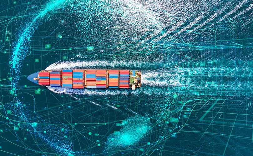 View from above of a ship full of containers, at sea