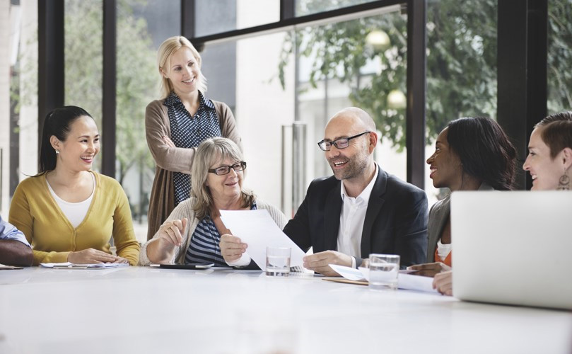 a group of people sitting around a table