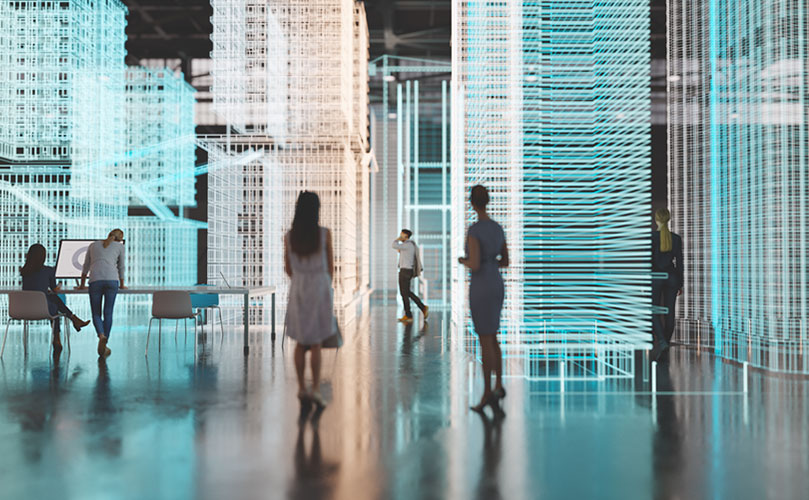 A group of people walking in a room with buildings made of light