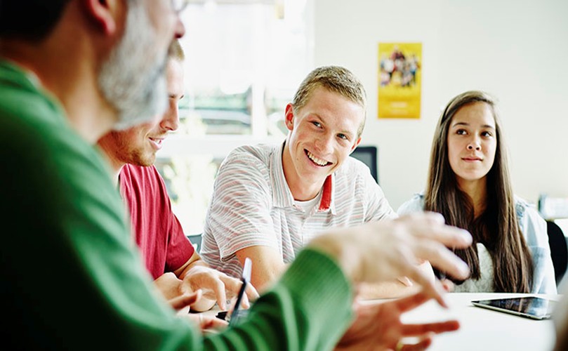 A group of people sitting on chair