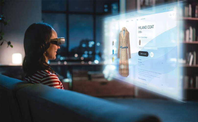 Woman watching an online shopping page on a VR projected screen