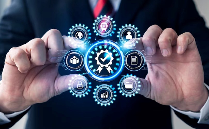 Businessman holding a virtual business icon, symbolizing digital innovation and entrepreneurship in a modern workspace.