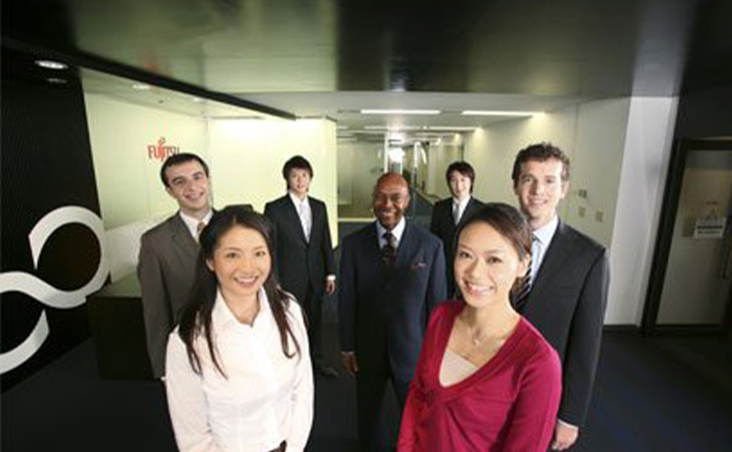 Diverse colleagues smiling at Fujitsu office