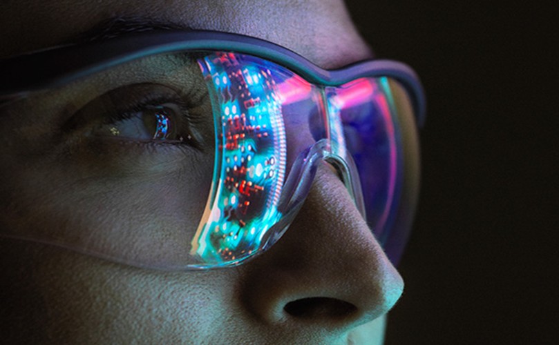  A person wearing glasses adorned with colorful lights, creating a vibrant and festive appearance.