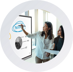 icon Two women examine a whiteboard displaying a detailed diagram, engaged in discussion and analysis.