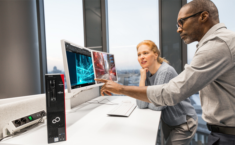 A person sitting at a desk with a computer