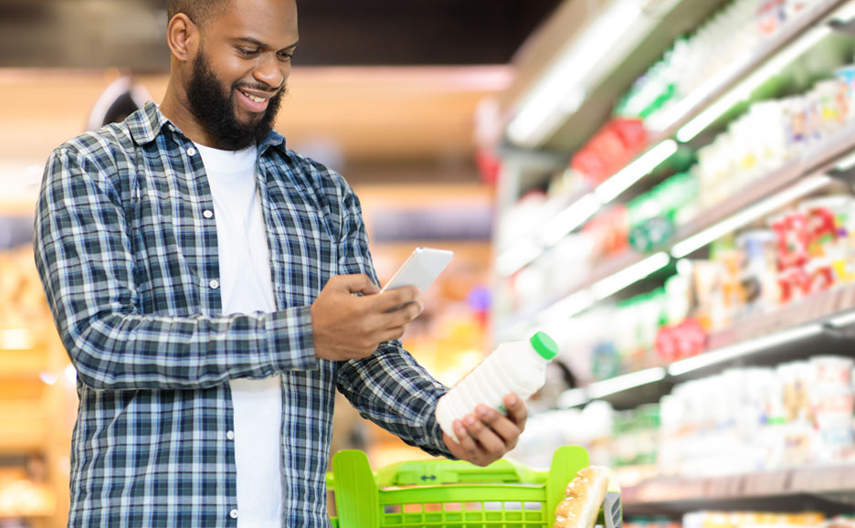 Man checking product labels at supermarket
