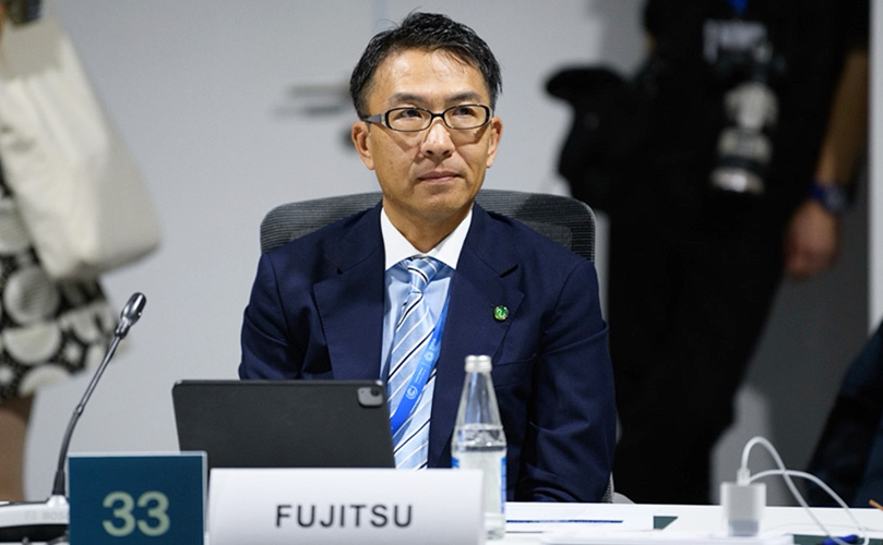 富士通株式会社 執行役員 EVP CSSO（最高サステナビリティ＆サプライチェーン責任者）山西 高志が、ITU（国際電気通信連合）が開催したハイレベルラウンドテーブルにおいて発言している写真