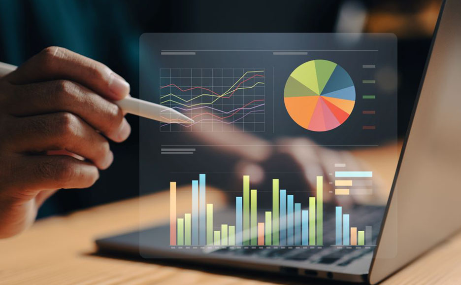 Hand analyzing data on a laptop with a digital pen