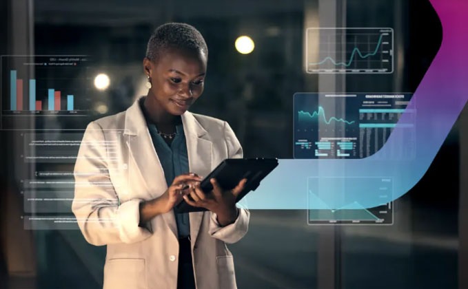 Woman on tablet with data visualizations.