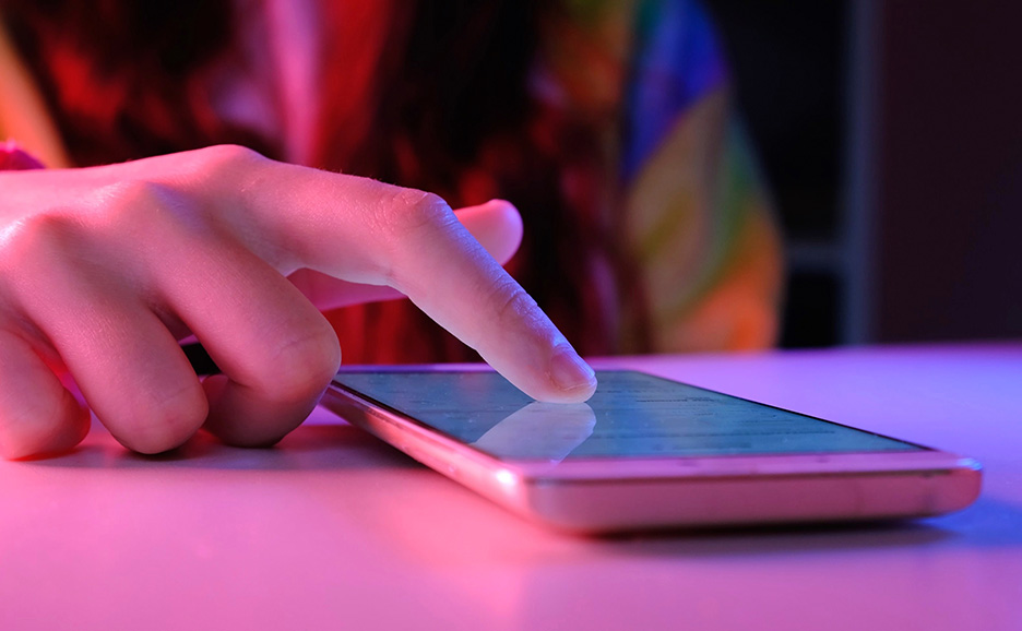 Close-up of a finger operating a smartphone