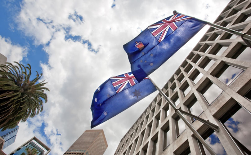 A shot from below of a building and the Australian flag