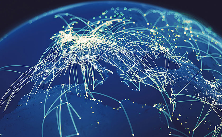 地球儀上に広がる光の線と点で、世界中のネットワーク接続と通信ハブを表現。グローバルな情報ネットワークのイメージです。