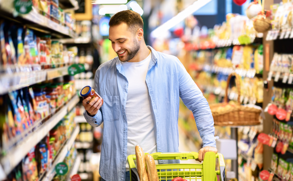 A man checking product labels at a supermarket