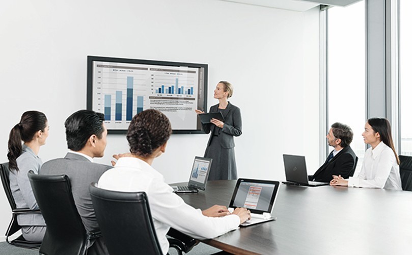  a business meeting with six professionals seated around a conference table