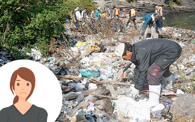 People cleaning up trash scattered along the coastline.
