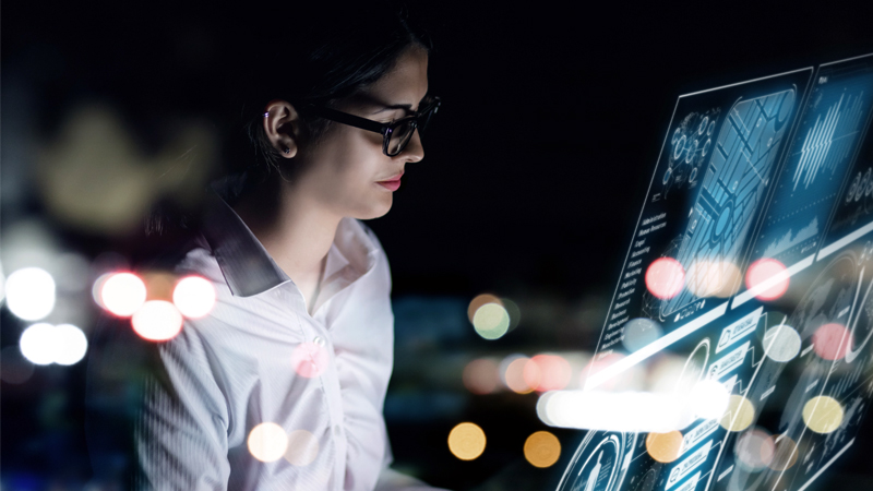 A woman is checking the results of the analysis on the screen