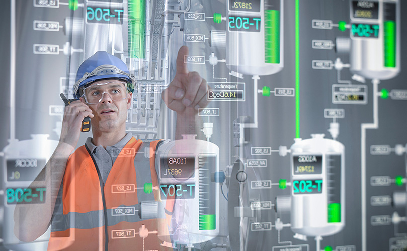 Factory supervisor monitors product levels on interactive displays