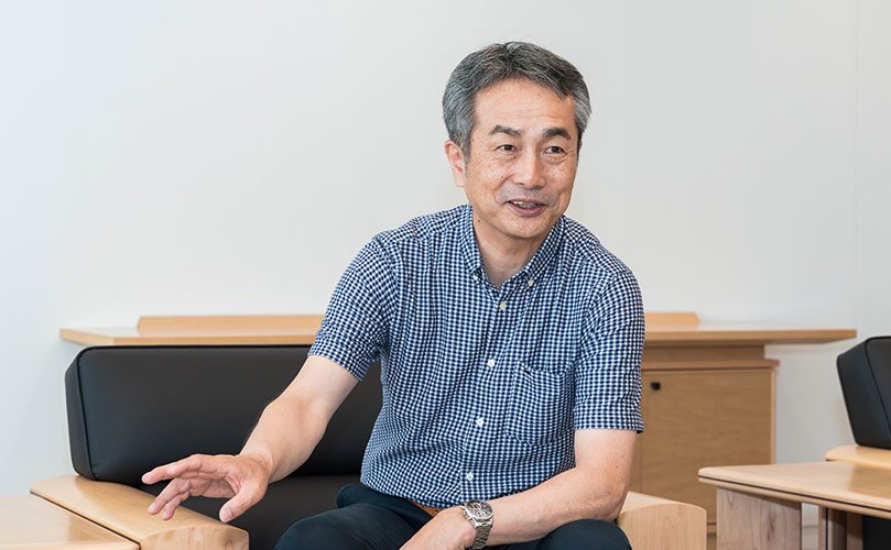 Scene from an interview showing Hideto Okada, SVP, Head of AI Strategy and Business Development Unit, Fujitsu Limited